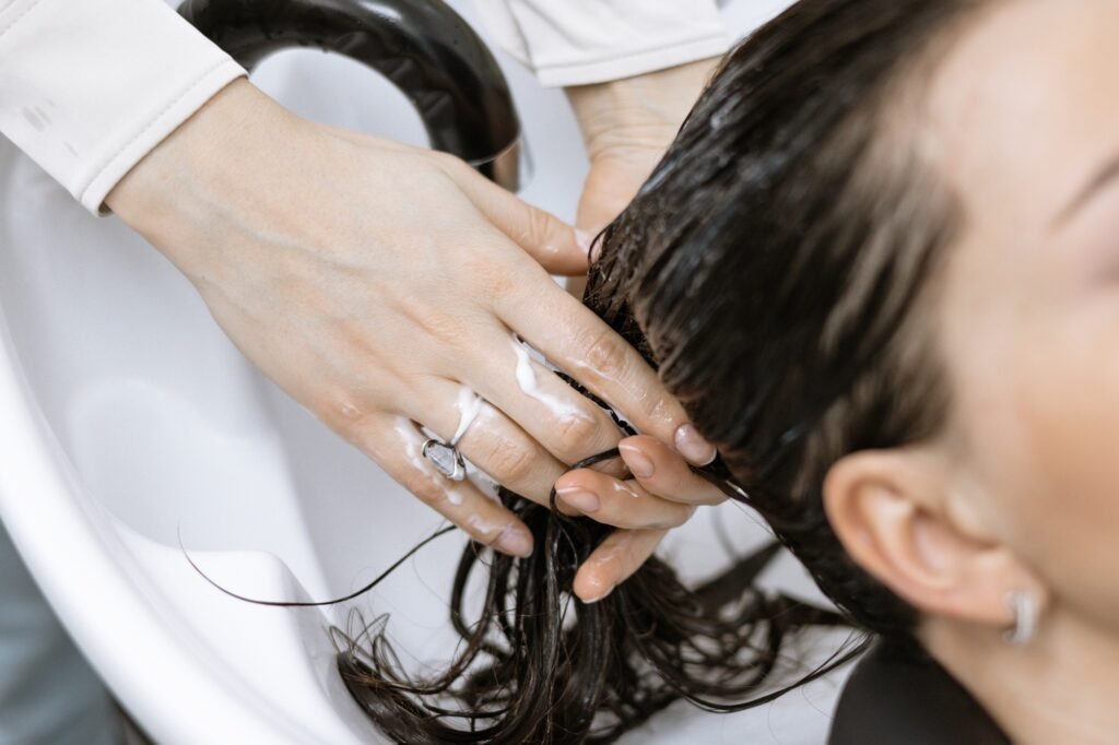 washing off hair care products in the beauty salon, washing hair in the salon